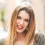 happy-blonde-girl-smiling-in-urban-background-Q3H6CNL.jpg